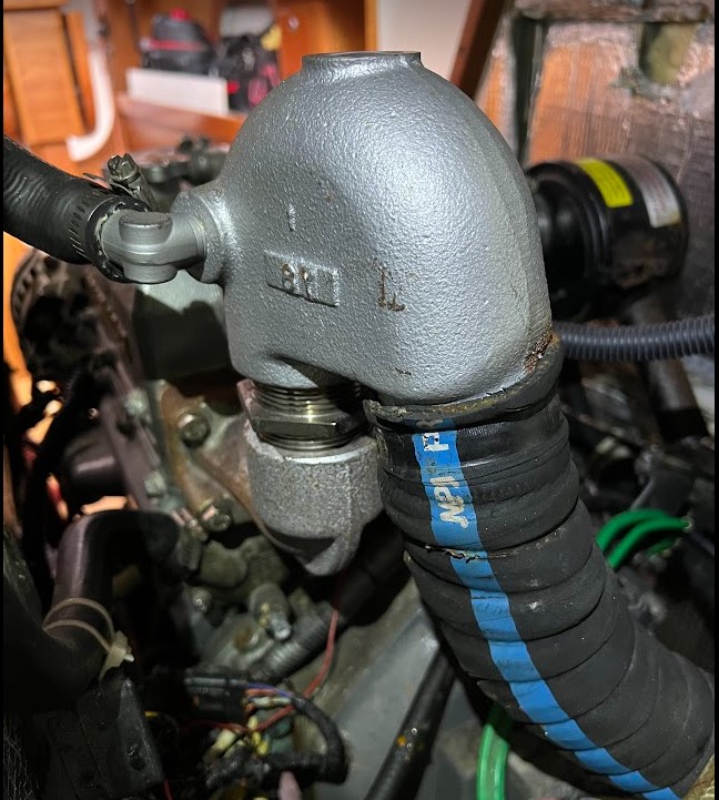 Old assembly in place with threads showing (hose clamp removed).